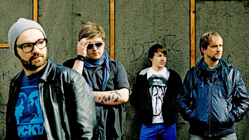 Four Men in Band Attire — Blue