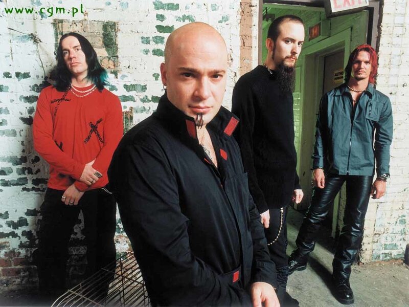 Four Men in Band — Black, Serious, Photograph, Band Members, Brick Wall