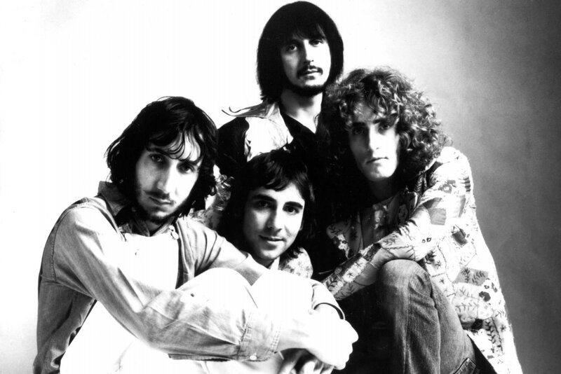 Four Men in Band Pose — Black, Serious, Photograph, Hair