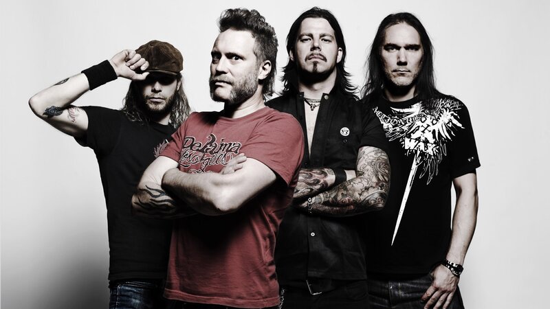 Four Men in Band Pose — Black, Serious