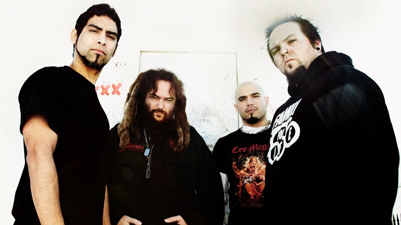 Four Men in Band Shirts — Black, Serious, Photograph