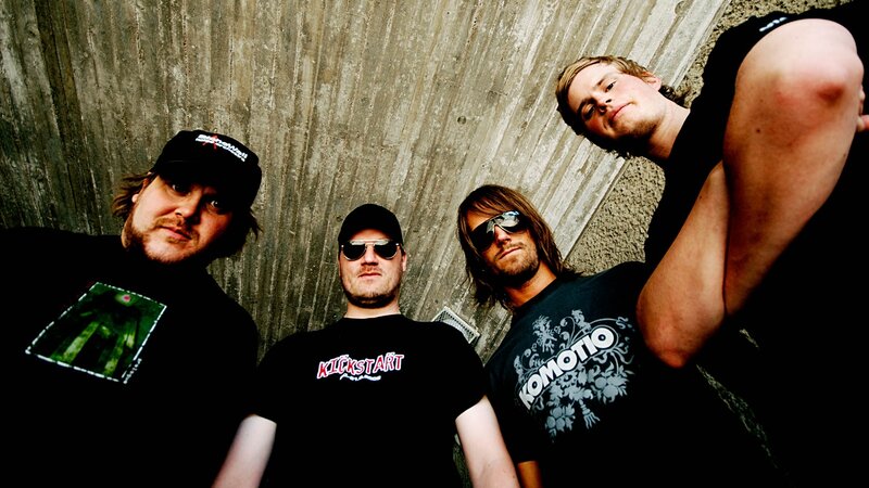 Four Men in Band Shirts