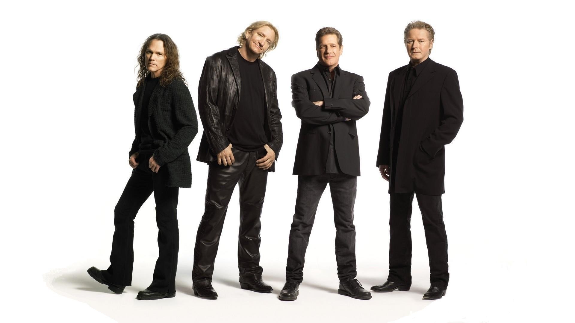 four men in black clothing