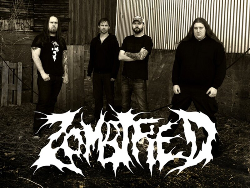 Four Men in Black Clothing — Serious, Photograph, Band Logo