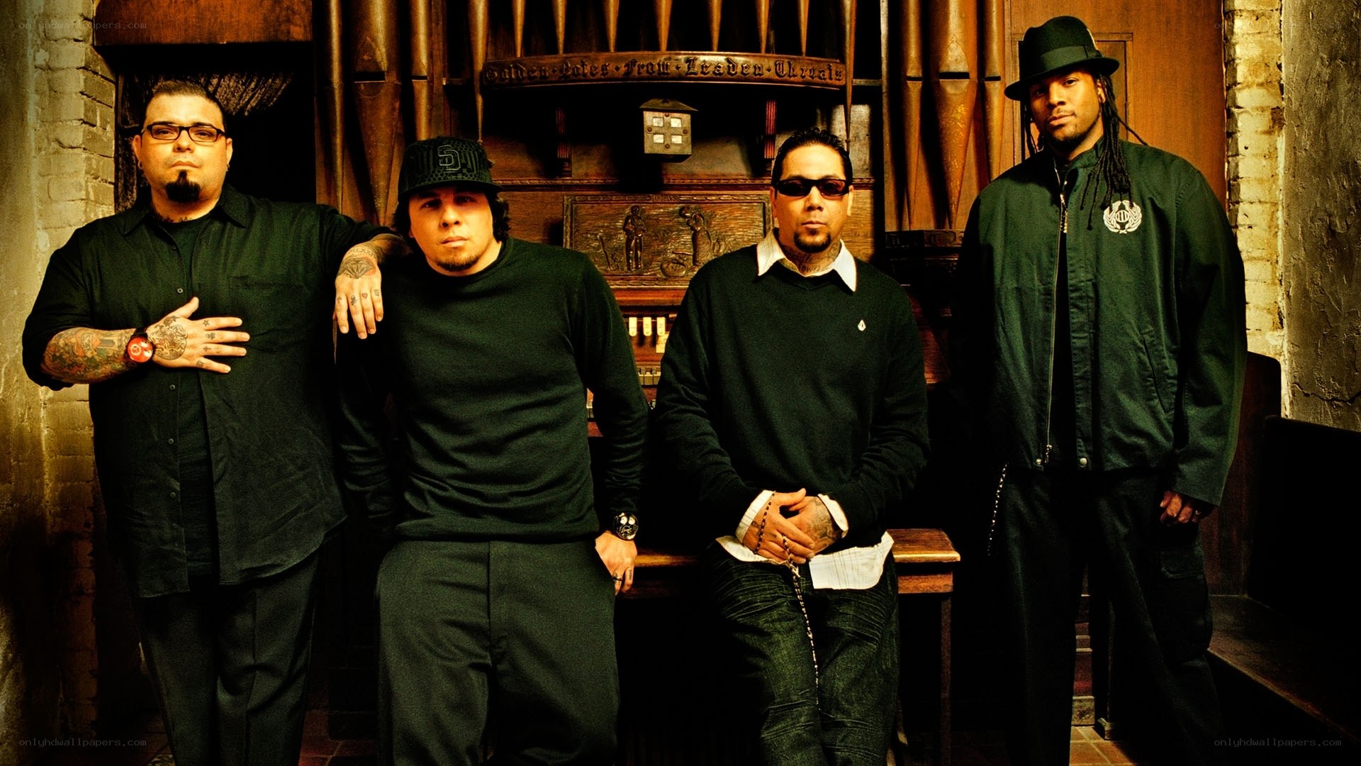 four men in black clothing