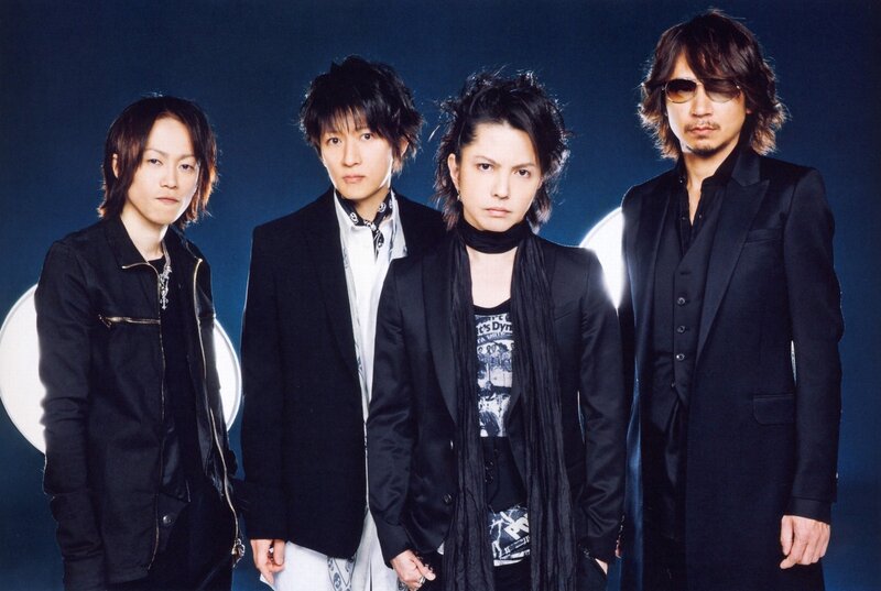 Four Men in Black Suits — Serious