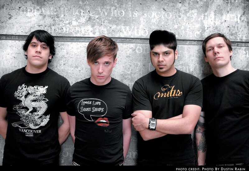 Four Men in Black T-shirts
