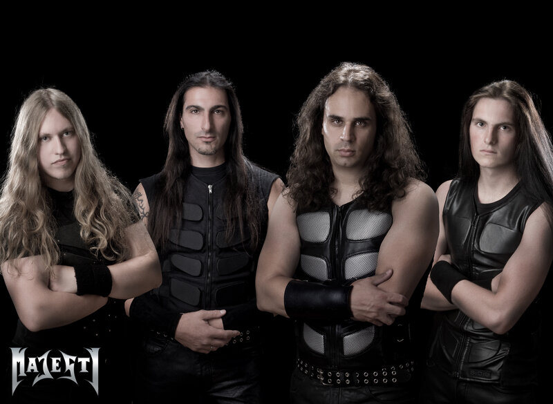 Four Men in Black Vests