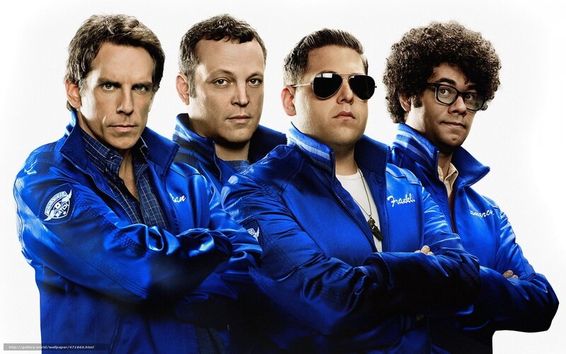 Four men in blue jackets