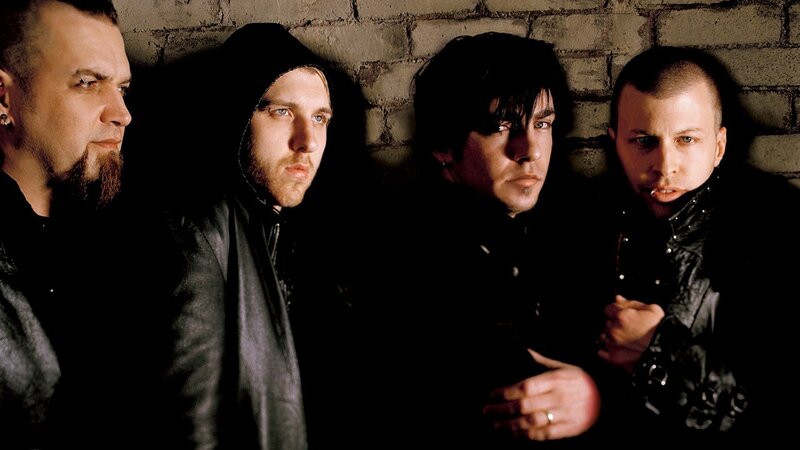 Four Men in Dark Clothing — Black, Serious, Photograph, Brick Wall, Hoodie