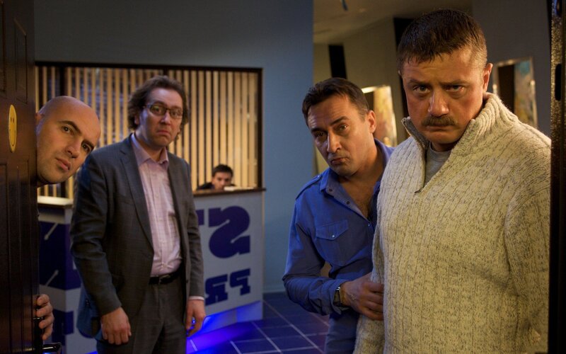 Four Men in Hallway