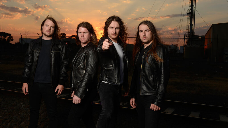 Four Men in Leather Jackets — Black, Dramatic, Sunset