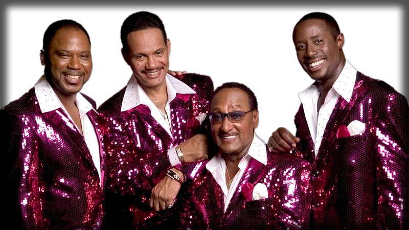 Four men in sequin jackets