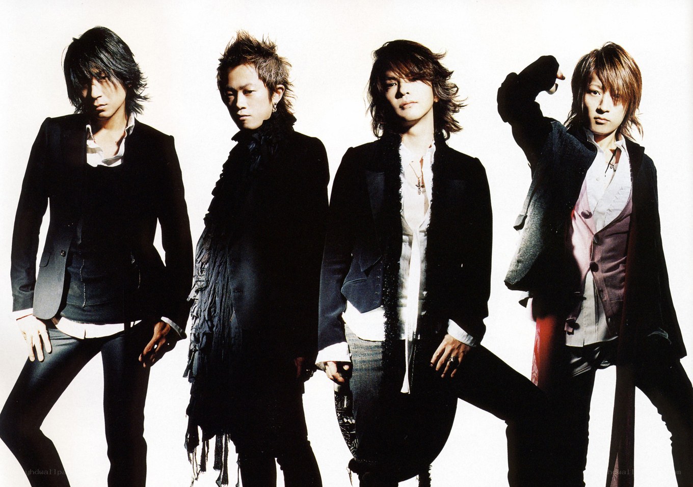 four men in stylish black outfits