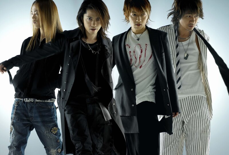 Four Men in Stylish Clothing — Black, Dramatic