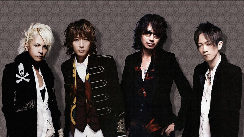 Four Men in Stylish Clothing — Black, Serious