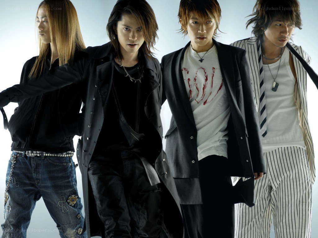 four men in stylish clothing