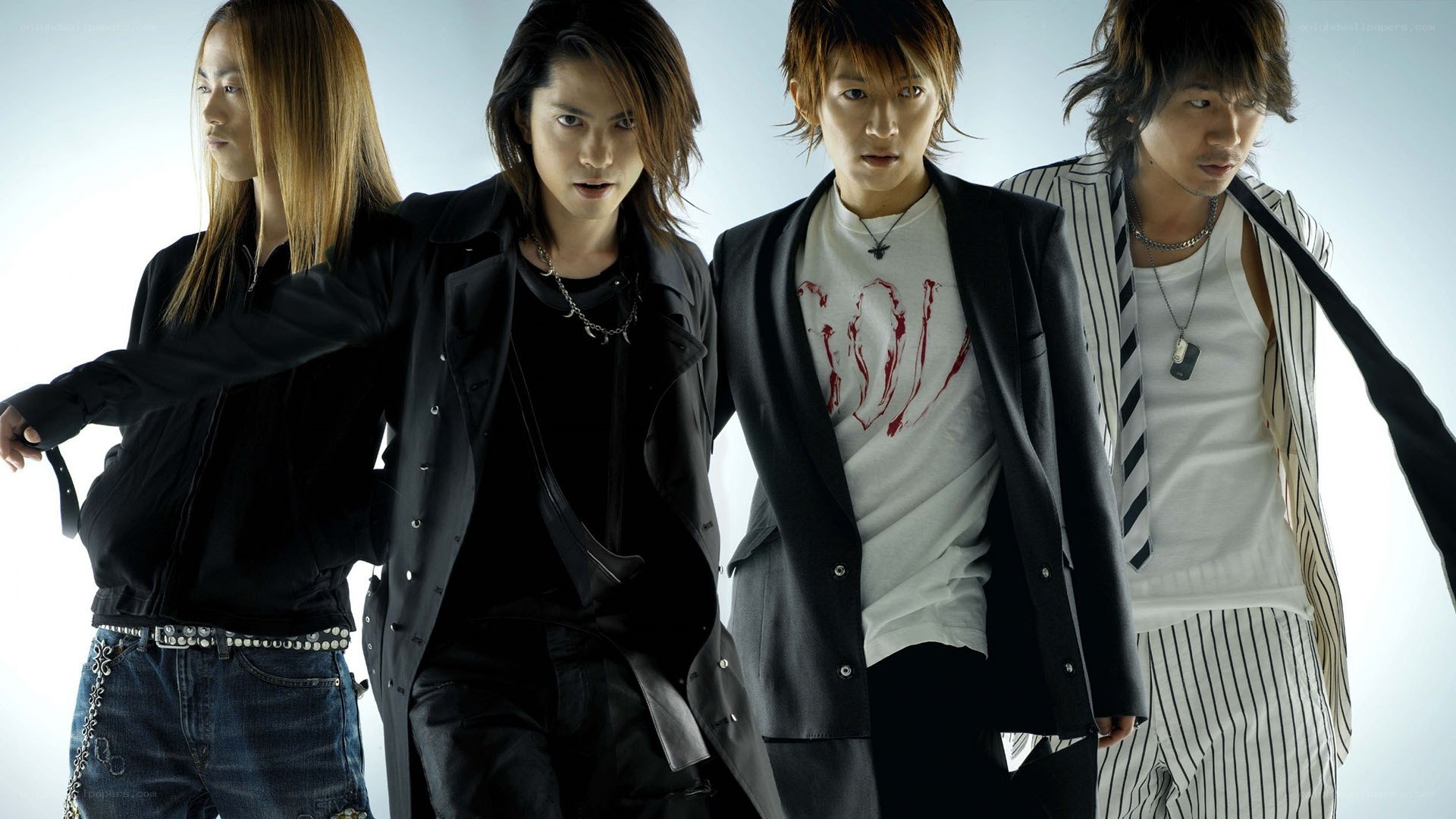 four men in stylish outfits