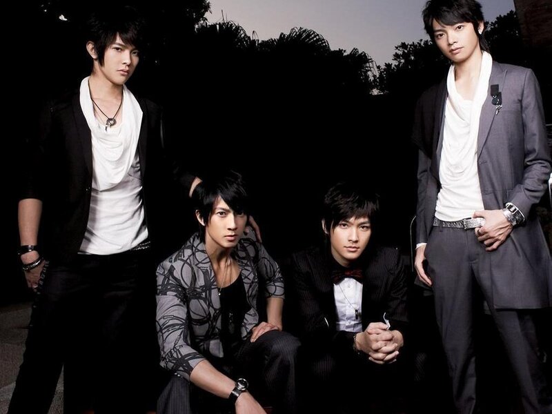 four men in stylish suits