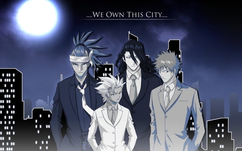 Four men in suits at night