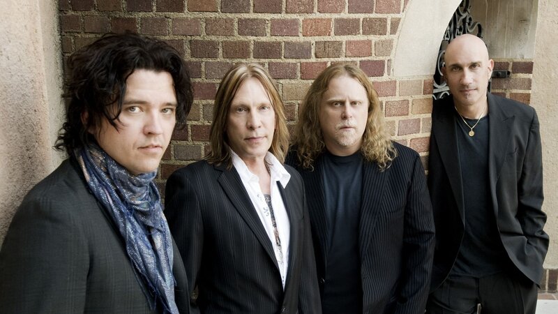 Four Men in Suits — Black, Serious, Photograph, Brick Wall