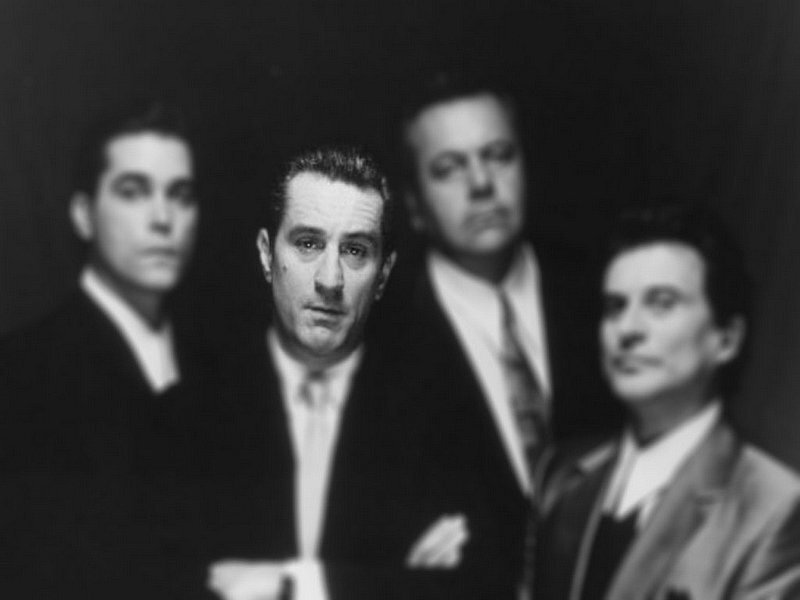 Four Men in Suits — Black, Serious