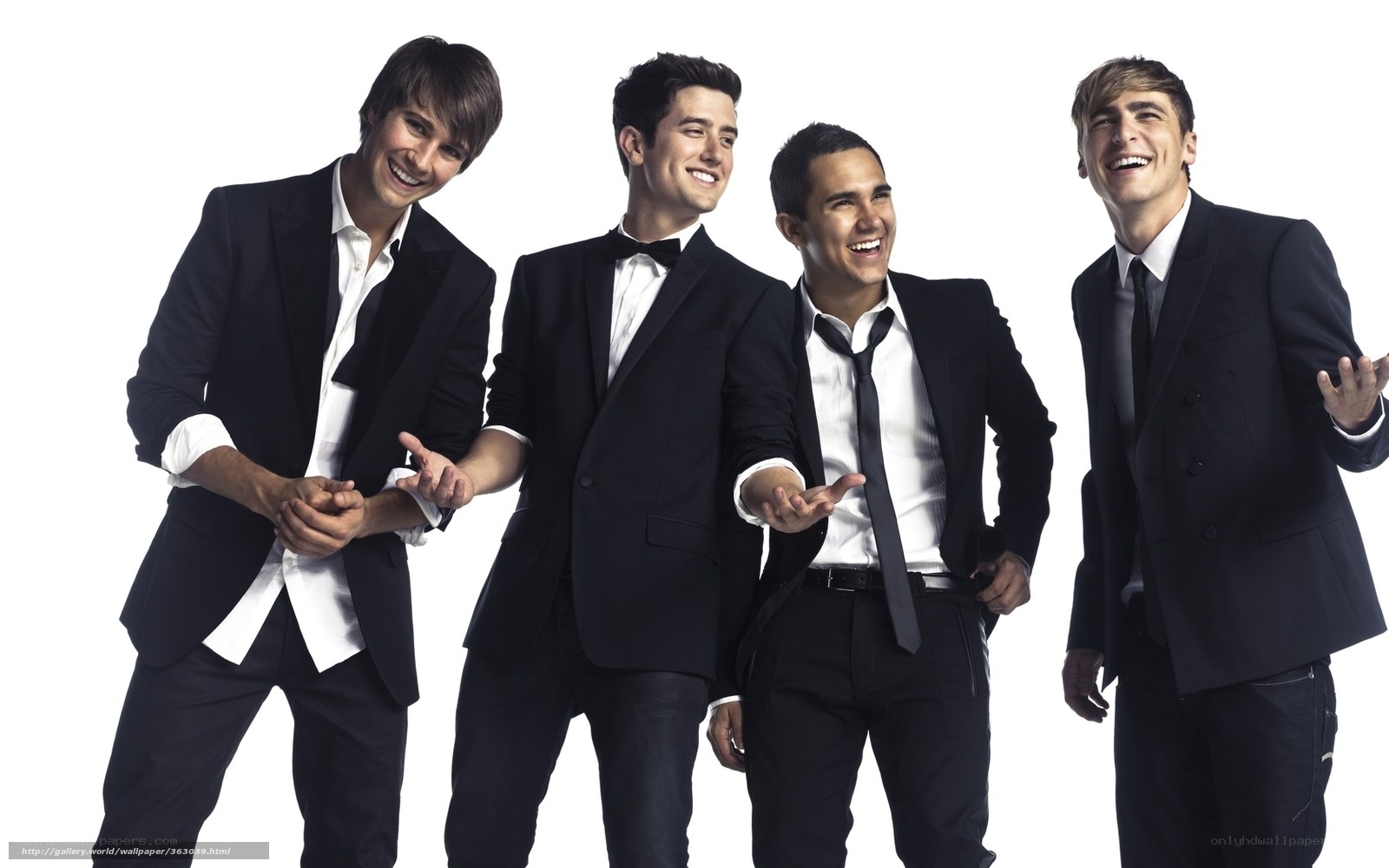 four men in suits laughing