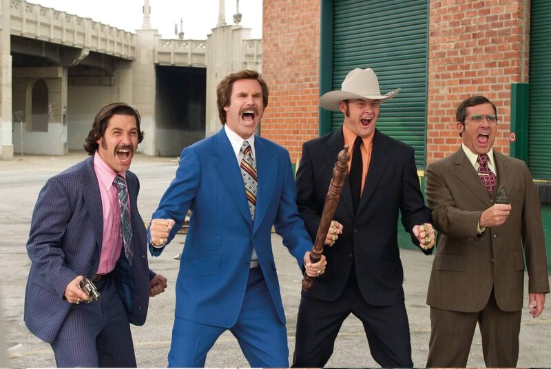 Four men in suits shouting