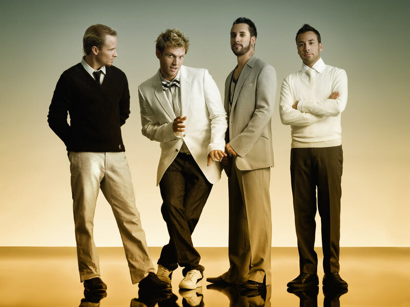 Four Men in Suits — White, Confident