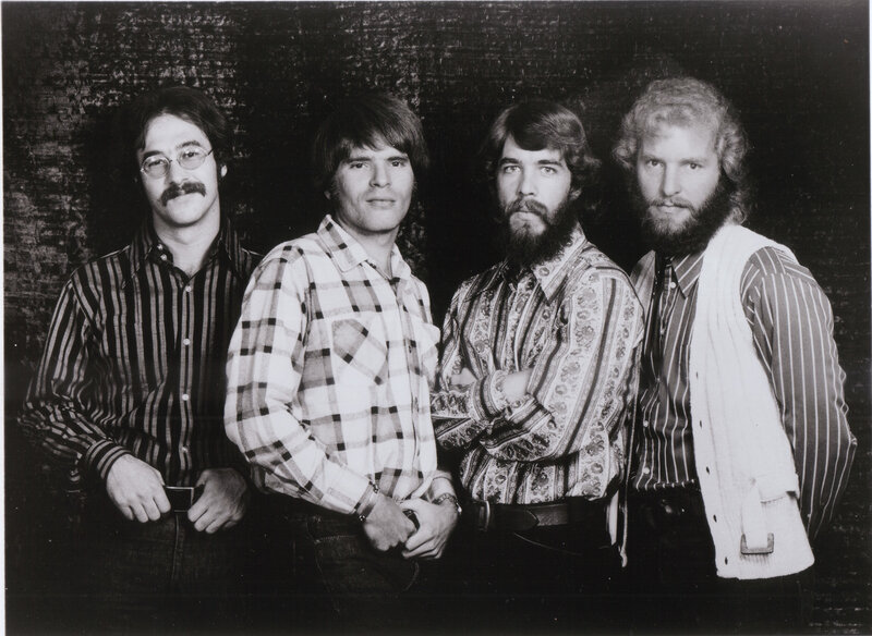 four men in vintage clothing