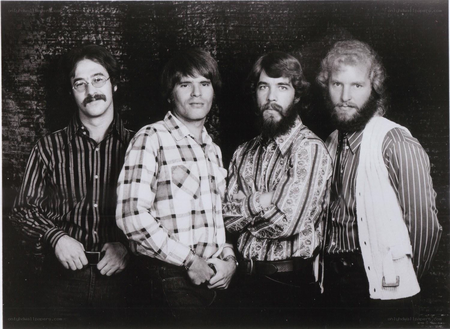 four men in vintage clothing