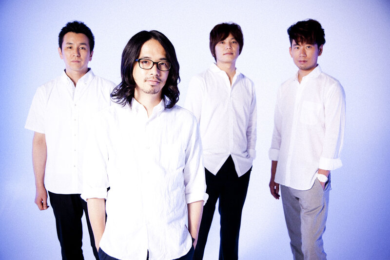 Four Men in White Shirts