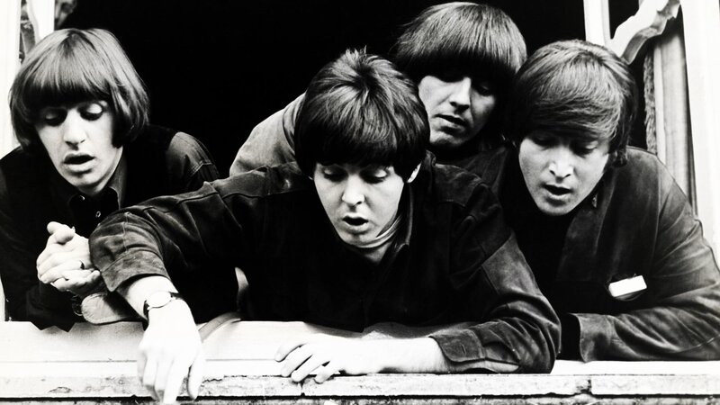 Four Men Leaning on Window