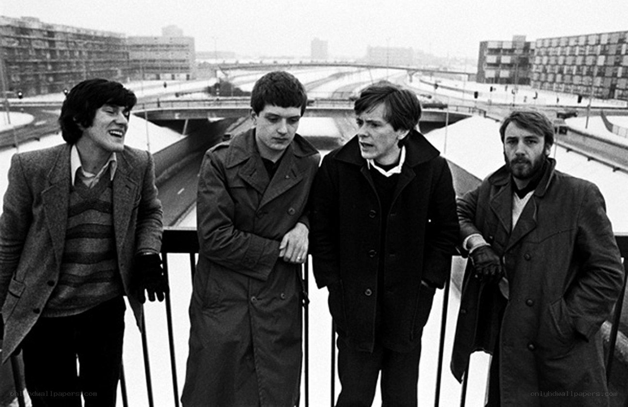 Four men on a bridge in winter
