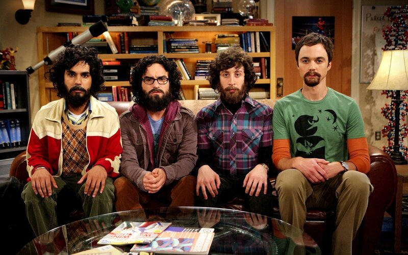four men on a couch