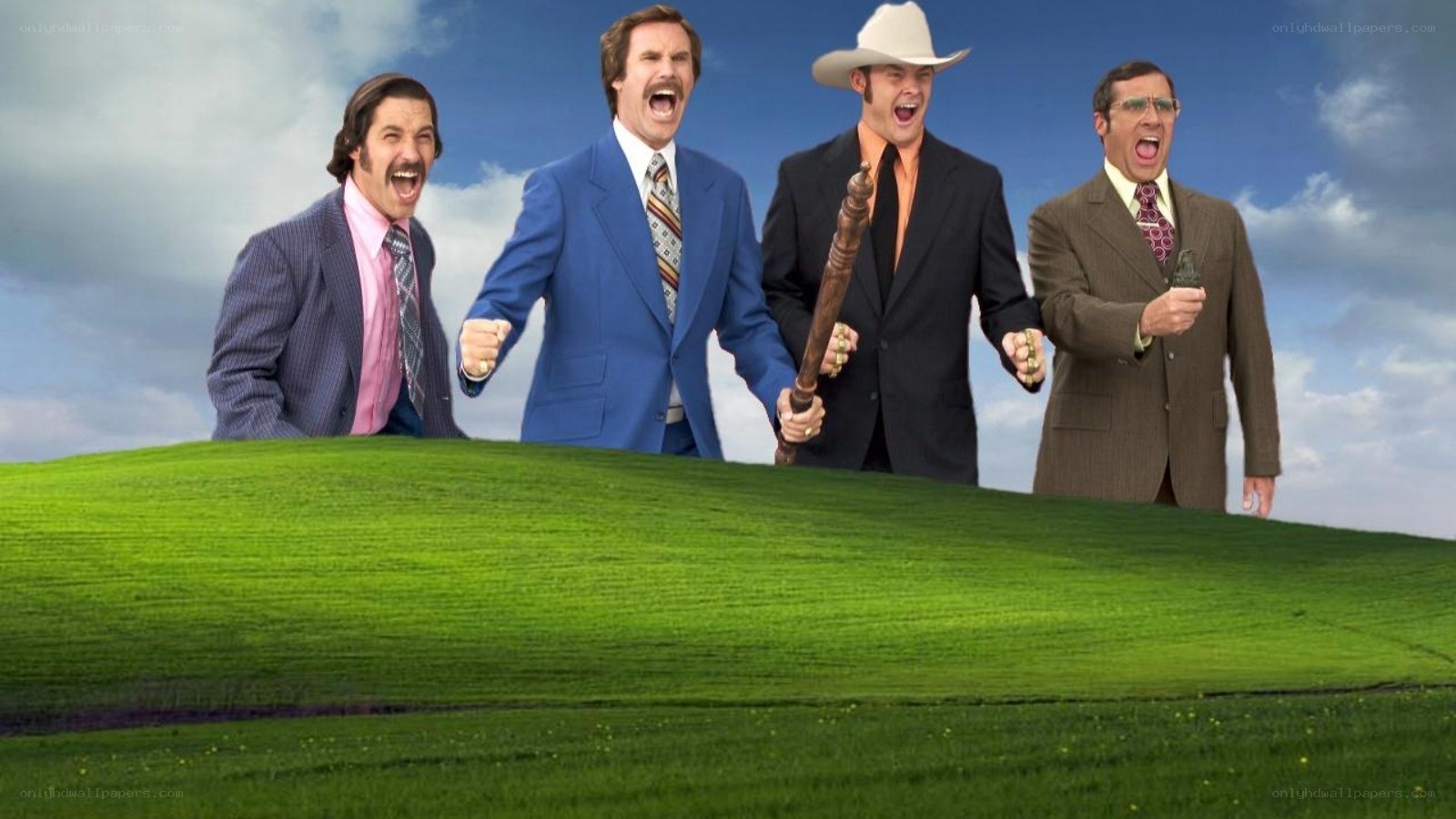 Four men on a green hill