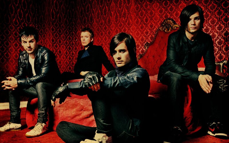 Four Men on a Red Couch — Dramatic