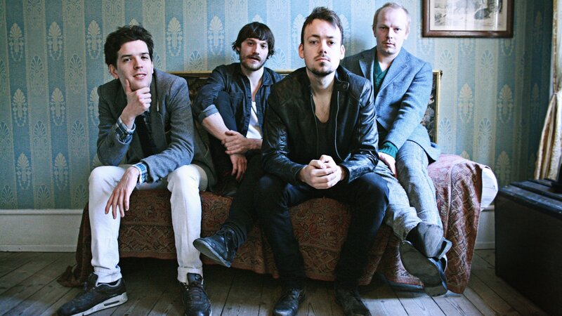 Four Men on a Sofa