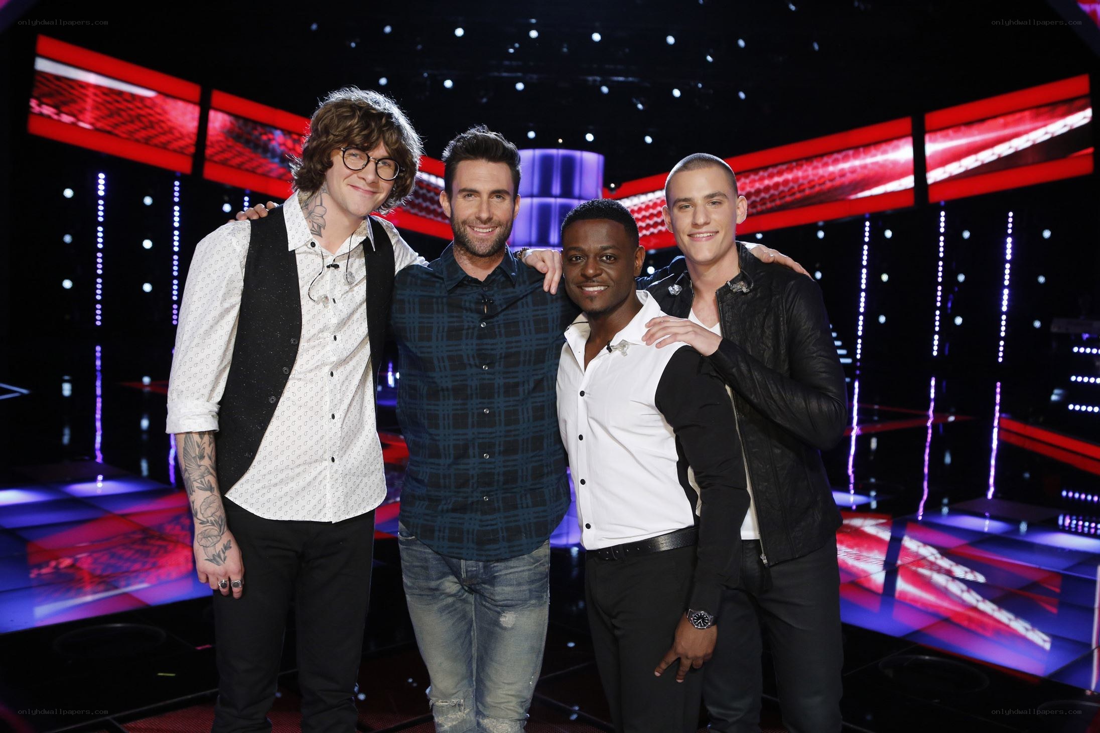 Four men on a stage