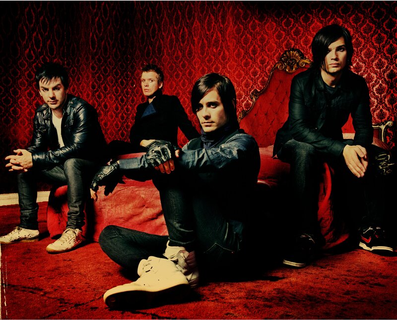 Four Men on Red Couch — Dramatic