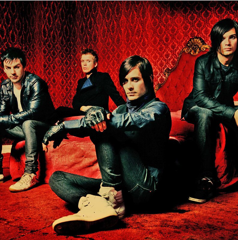 Four Men on Red Couch