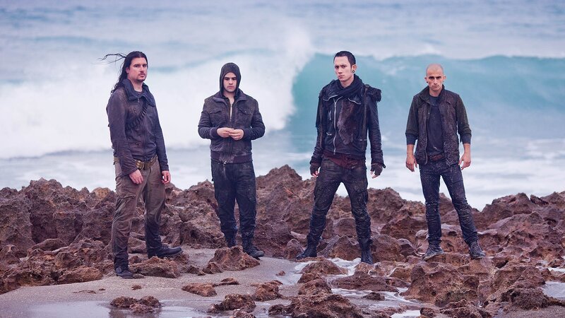 Four Men on Rocks — Brown, Dramatic