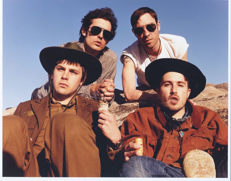 Four Men on Rocks
