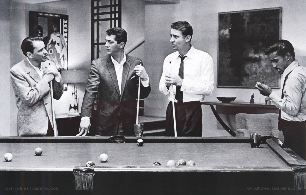Four men playing pool