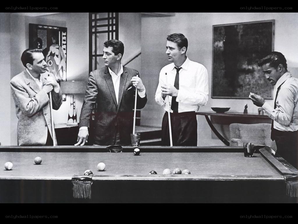 Four men playing pool