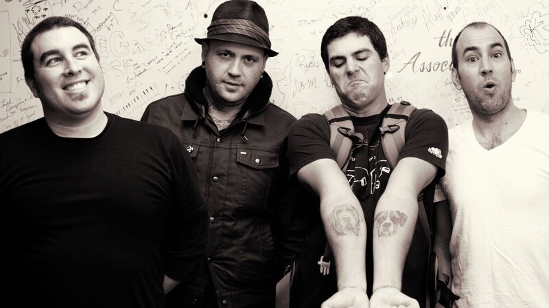 Four Men Posing — Black