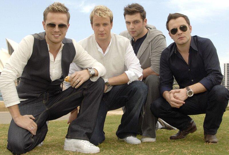 Four Men Posing on Grass