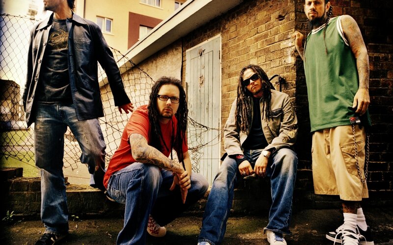 Four Men Posing Outdoors