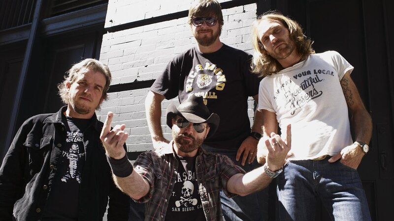 Four Men Posing Outside
