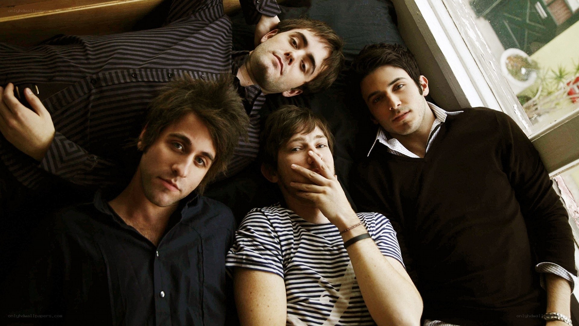 four men posing together